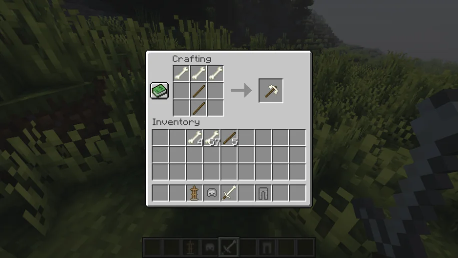 Crafting a bone pickaxe from the Bone Equipment mod