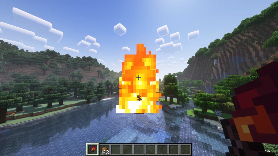 The Infernal Scepter from the Things mod shooting a fireball in Minecraft